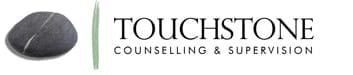 Touchstone Counselling & Supervision logo featuring a smooth stone with a white line and a green vertical line.